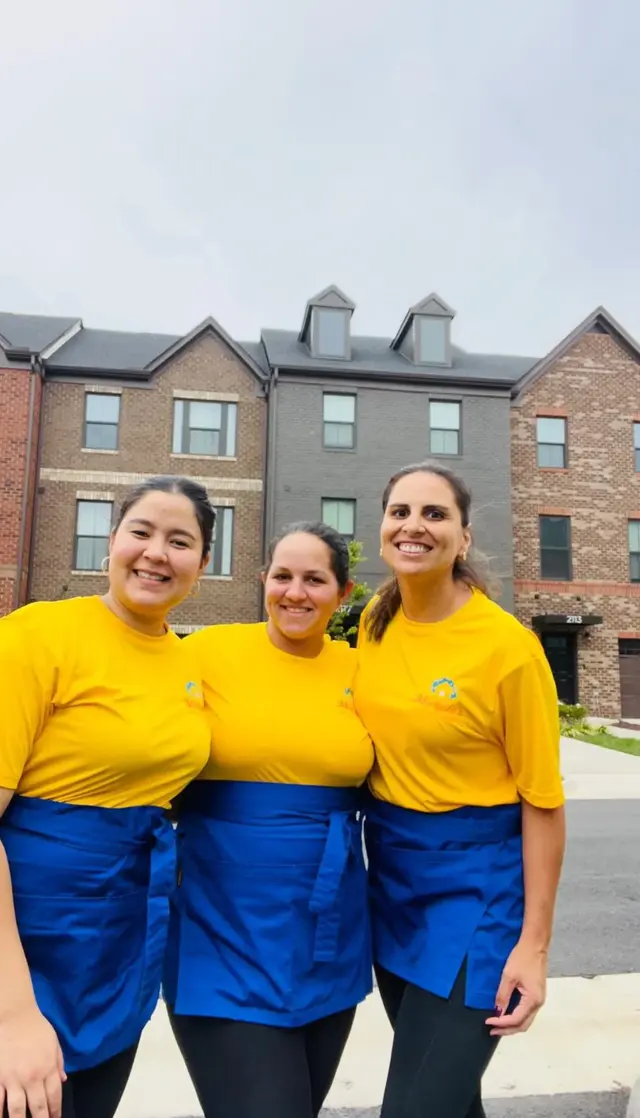 Michele's Cleaning team in their yellow branded shirts